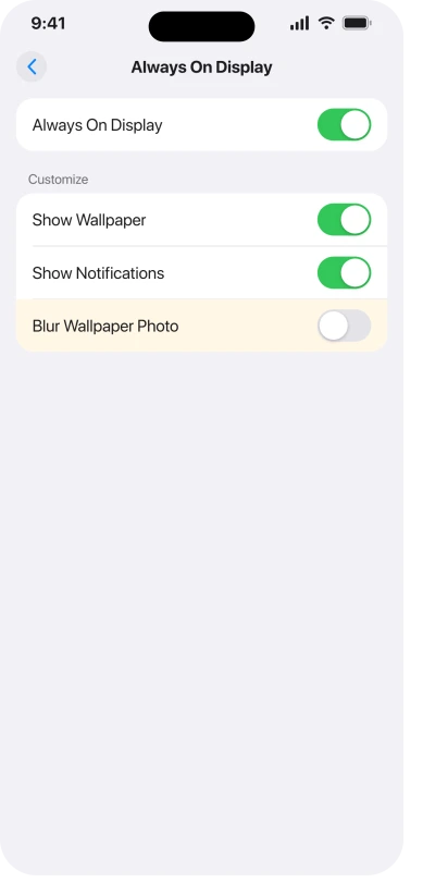 The Always On Display screen in iOS 26 Settings, Display and Brightness, showing Show Wallpaper and Show Notifications on and Blur Wallpaper Photo switched off under the Customize heading