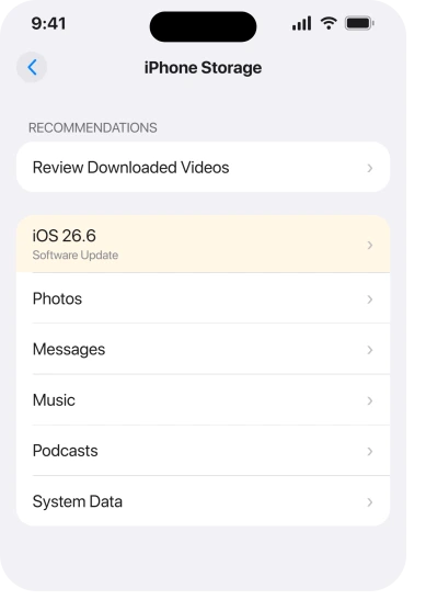 Settings, General, iPhone Storage, where a downloaded iOS update appears in the list
