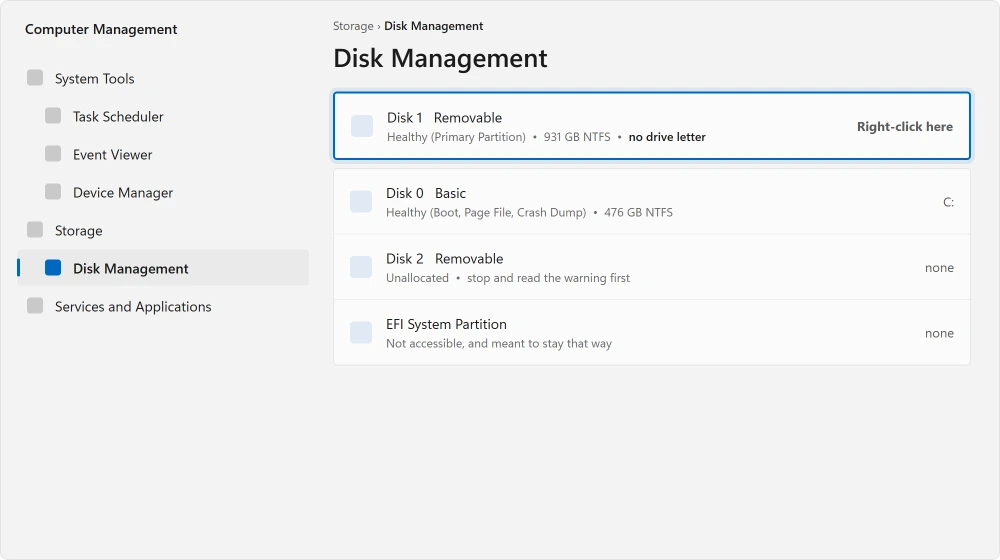 Disk Management with an external drive showing a healthy volume and no letter